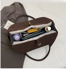 Spacious coffee brown suede tote bag interior showing ample storage for daily essentials