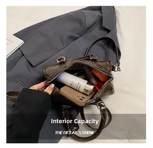 Internal view of dark brown PU Boston bag showing storage capacity for daily essentials