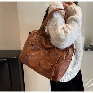 Détails du sac fourre-tout marron caramel avec poches zippées et tirettes de épingle