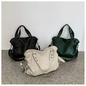 Three colors of large capacity faux leather tote bags with rivet details and shoulder straps