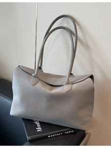Minimalist grey suede tote bag for women with long handles and a structured flap closure