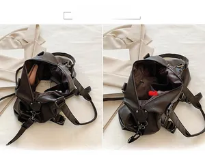 Detail view of large capacity interior main compartment and pockets in brown tote bag