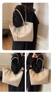 Detail of beige large tote bag showing back zipper pocket and detachable shoulder strap