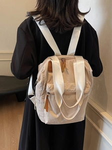 Minimalist beige large capacity backpack with adjustable straps for women and students