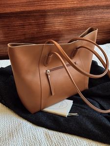Classic caramel brown tote bag with large capacity and front zipper pocket detail
