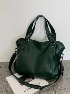 Large dark green tote bag with lychee grain texture and vintage metal rivets
