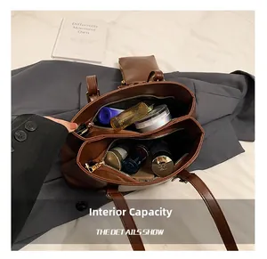 Detail view of the large capacity interior with dual compartments and zipper pocket