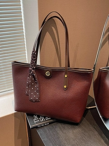 Chic burgundy lychee leather tote bag with polka dot scarf and gold logo for daily commute