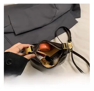 Detail view of the vintage dumpling bag interior showing capacity for daily essentials