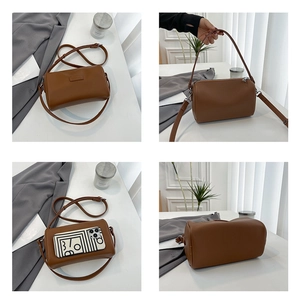 Detailed views of brown pebble leather barrel bag with adjustable strap and spacious interior