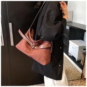 Detail view of the brown frosted PU suede shoulder bag with leather strap and buckle
