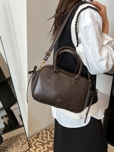 Retro dark brown matte leather Boston handbag with gold lettering and adjustable strap