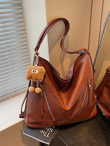 Retro dark brown large tote bag with zipper details and cute plush charm on books