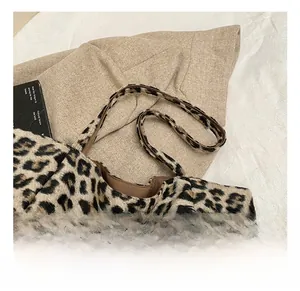 Detailed shot of comfortable double leopard print faux fur handles on a large tote bag