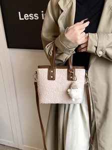 Retro bucket bag in beige plush shearling and brown leather trim for women