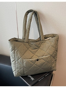 Olive green quilted tote bag for women with diamond stitch and black snap pocket