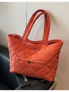 Quilted orange tote bag in lightweight nylon with large capacity and snap pocket