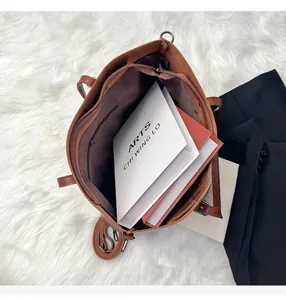 Spacious interior of brown faux leather tote bag showing large capacity for A4 magazines
