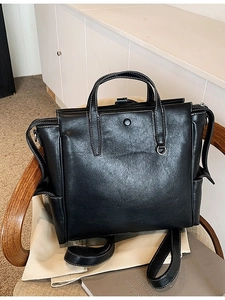 Retro black leather backpack for students with high-capacity design and contrast stitching