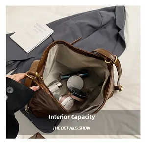 Detailed interior of the brown tote bag showing large capacity for cosmetics