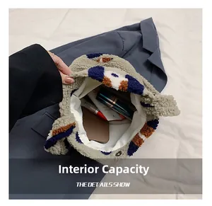 Detail showing internal capacity of the plush patterned shoulder bag with soft lining