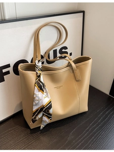 Classic khaki leather tote bag with elegant scarf decor and spacious interior for women
