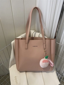 Pink tote bag with AIBEIDA logo on a shopping cart with high-end aesthetic style