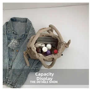 Detailed interior view of a large capacity quilted nylon tote bag with daily essentials
