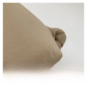 Detail showing the premium woven texture of the khaki puffer tote bag fabric