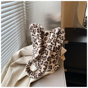 Close-up of plush faux fur leopard print tote bag with soft texture for winter