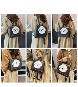 Detail view of vintage dark brown backpack featuring a plush white cartoon dog pattern