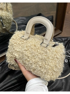 Chic curly faux fur mini box bag with smooth leather handles and silver hardware