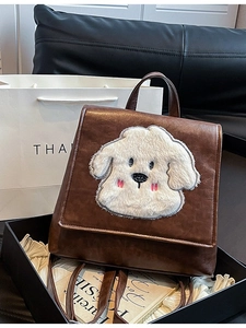 Retro brown PU leather backpack for women featuring a plush white cartoon dog patch