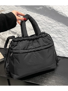 Quilted puffer tote bag for women in black nylon with drawstring and zip pocket