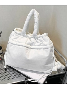 White quilted puffer tote bag with drawstring closure and large capacity design