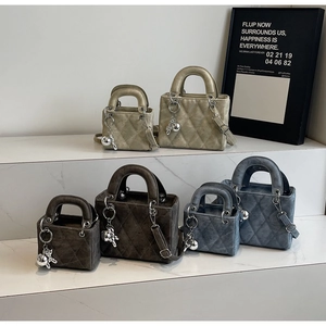 Quilted crossbody bags in beige, brown and blue with top handles and bear charm
