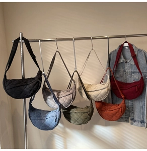 Quilted nylon crescent bags with adjustable straps shown in seven different colors