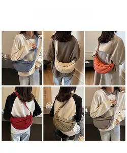 Quilted crescent crossbody bags displayed in six colors with adjustable woven straps