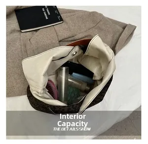 Internal capacity of leopard print tote bag with magnetic closure and beige lining