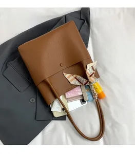Top view of brown lychee texture leather bucket bag showing large storage capacity space