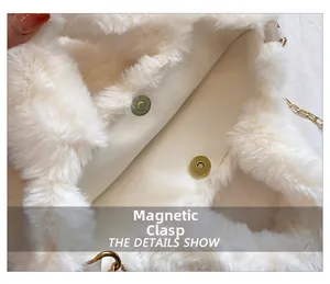 Detail of the golden magnetic buckle closure on a soft white faux fur plush handbag