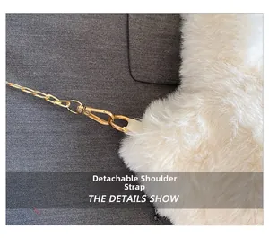 Detail of detachable gold metal chain strap on a white fluffy plush handbag