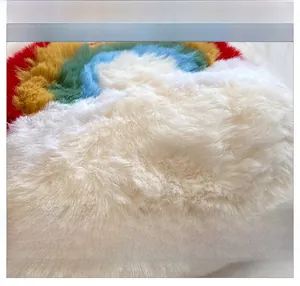 Close-up of vibrant rainbow faux fur fabric showing soft plush texture and colorful fibers