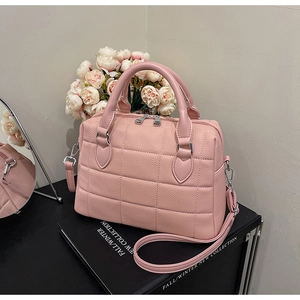 Pink lychee grain leather Boston bag with square quilting and silver metal hardware