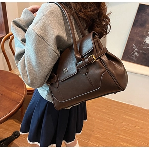 Deep brown PU leather shoulder bag showing practical capacity and elegant underarm fit