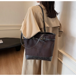 Retro large brown tote bag detail with leather straps and gold hardware for women