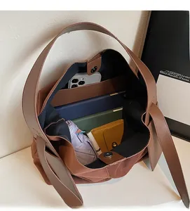Top view of the spacious interior of this brown suede tote bag showing its large capacity