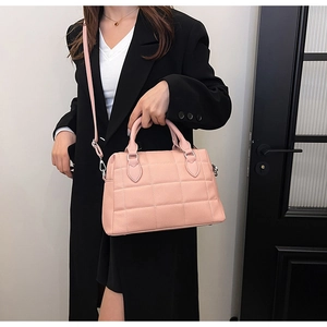 Pink quilted tote bag with lychee texture leather and silver metal hardware details