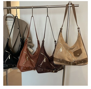 Detailed close-up showing suede texture and metal buckle accents on these hobo bags