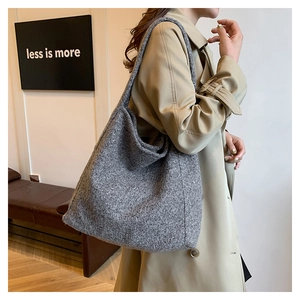 Detail of grey fleece tote bag showing texture and spacious capacity for daily commute